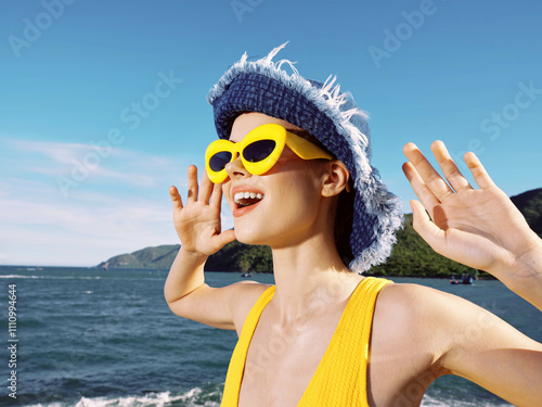 Beach woman with sunglasses and hat, hands raised, smiling a woman on the beach wearing sunglasses and a hat, with her hands joyfully raised in the air and a big smile on her face, enjoying the sunny photo