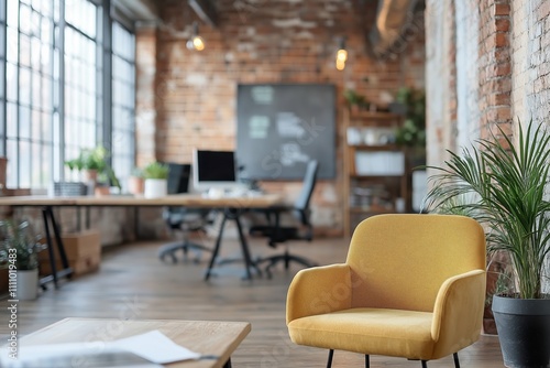 Bright and modern workspace featuring a cozy chair and greenery