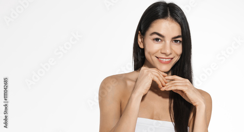 Billede på lærred Glamourous woman Latino-American beauty model with dewy skin, applying cleansing