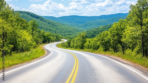 Serene Winding Road Through Lush Green Hills Under Bright Sky