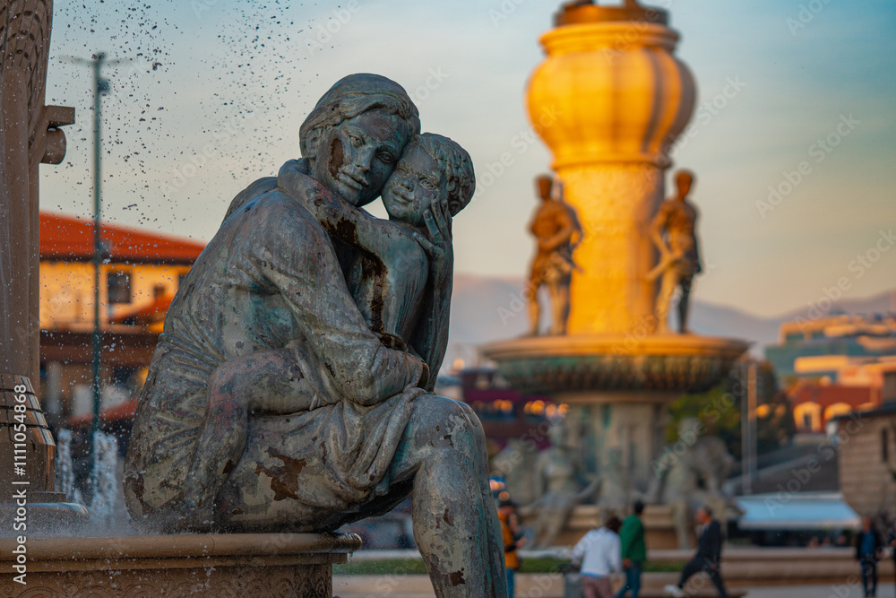 A bronze fountain sculpture in Skopje's Old Charshija, North Macedonia, surrounded by cultural landmarks and autumn hues A bronze fountain sculpture in Skopje's Old Charshija, North Macedonia, surrounded by cultural landmarks and autumn hues