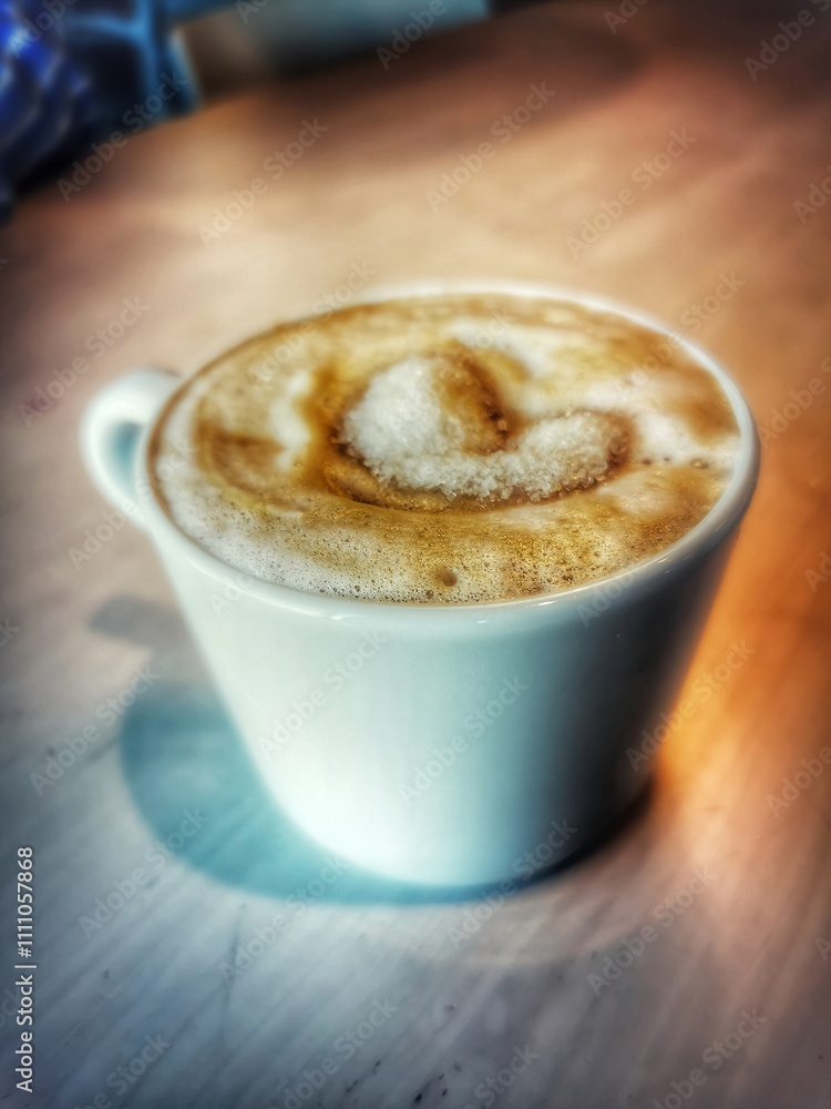 delicious cup of coffee on a wooden table delicious cup of coffee on a wooden table