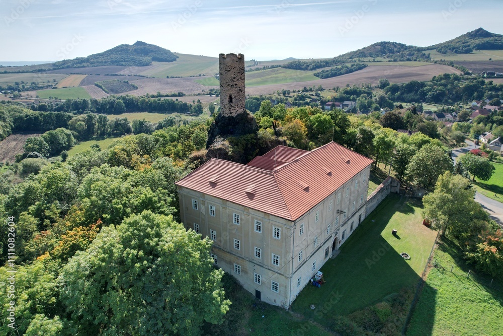 Aerial panorama of Skalka Castle in Vlastislav Bohemia showcasing its historical significance and scenic surroundings in the Czech countryside, a blend of culture and nature. Aerial panorama of Skalka Castle in Vlastislav Bohemia showcasing its historical significance and scenic surroundings in the Czech countryside, a blend of culture and nature.