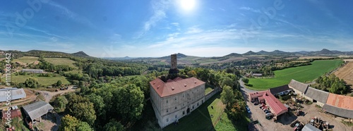 Aerial panorama of Skalka Castle in Vlastislav Bohemia showcasing its historical significance and scenic surroundings in the Czech countryside, a blend of culture and nature.