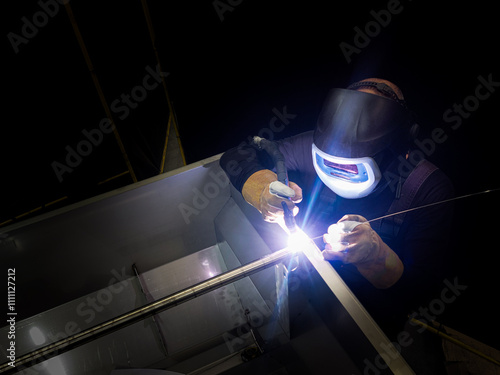 Professional Welding Scene Capturing the Precision and Intensity of TIG Metalwork
