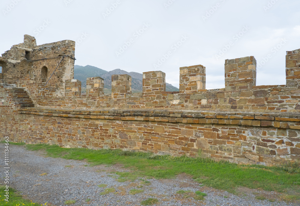 Old Genoese fortress in the city of Sudak in summer. Ancient architecture of Crimea.