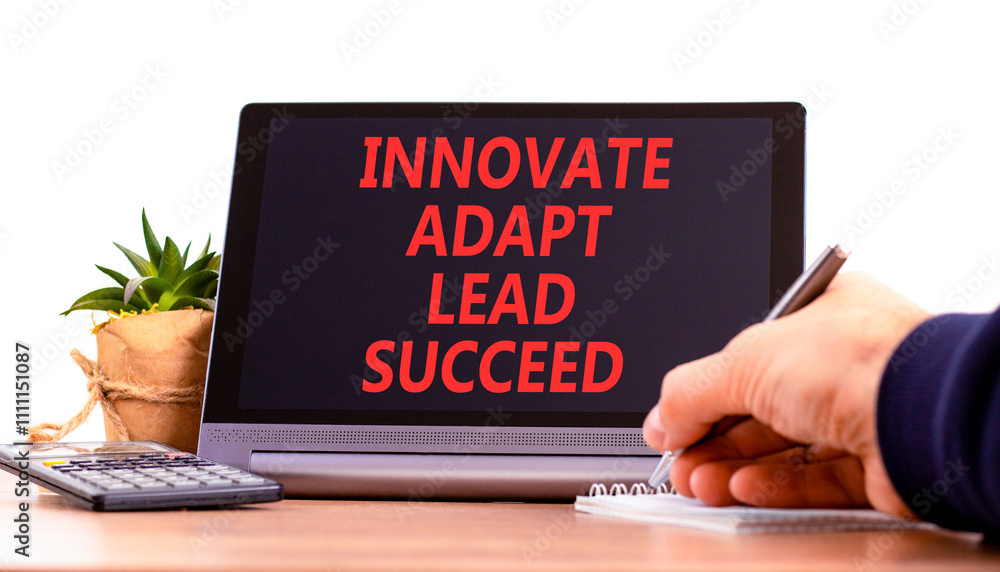 Innovate adapt lead succeed symbol. Concept words Innovate Adapt Lead Succeed on beautiful tablet. Beautiful white background. Businessman hand. Business innovate adapt lead succeed concept Copy space Innovate adapt lead succeed symbol. Concept words Innovate Adapt Lead Succeed on beautiful tablet. Beautiful white background. Businessman hand. Business innovate adapt lead succeed concept Copy space