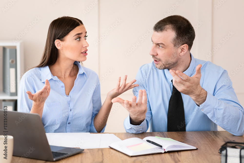 Corporate Communication. Businessman And Businesswoman Talking Discussing Business Project At Workplace In Modern Office. Corporate Communication. Businessman And Businesswoman Talking Discussing Business Project At Workplace In Modern Office.