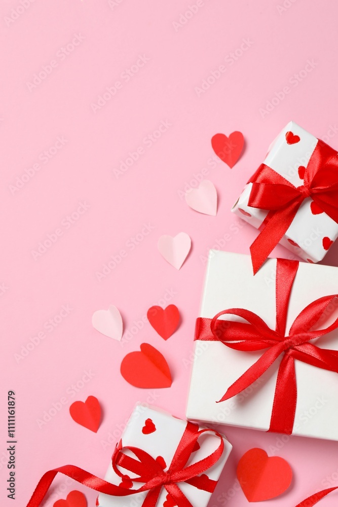 Gift boxes with red hearts on color background Gift boxes with red hearts on color background