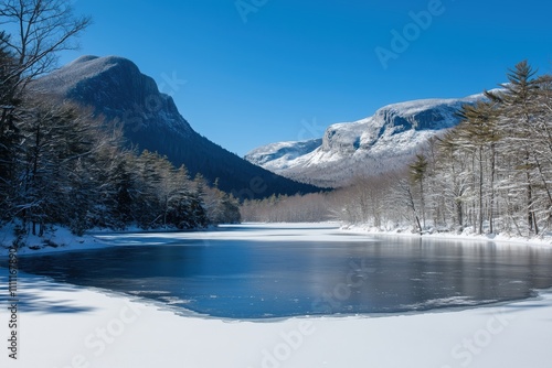 Majestic peaks frame a tranquil, frozen lake