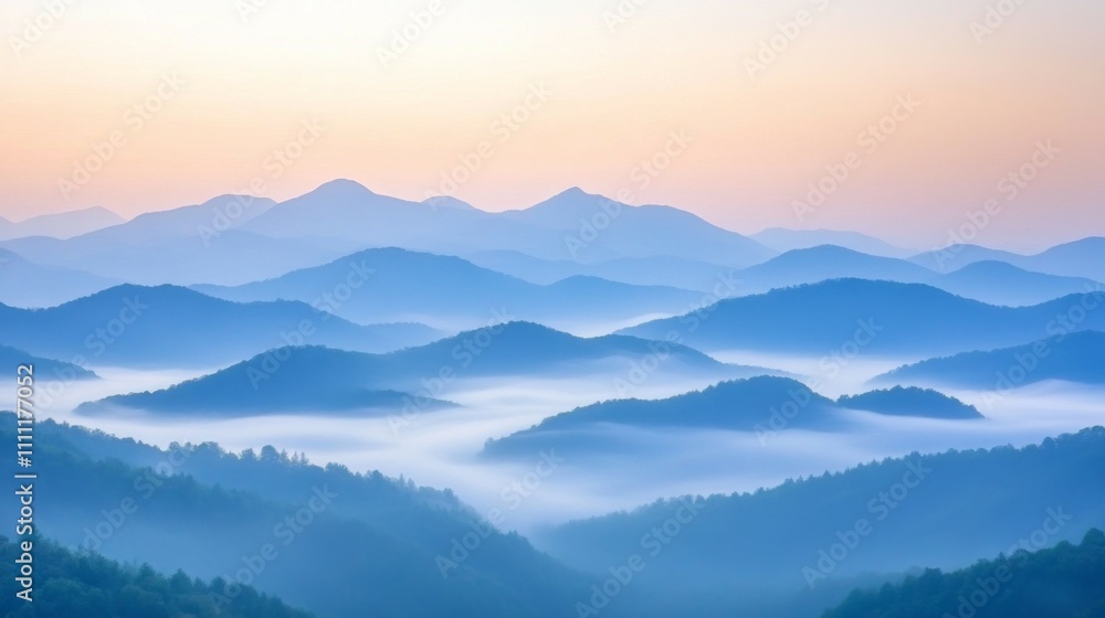 Obraz premium Misty Mountain Ranges at Dawn with Soft Pink and Blue Hues