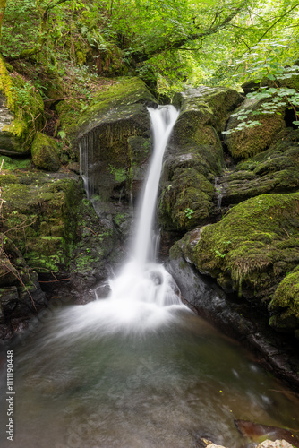 Long exposure of a waterfall on the Hoar Oak Water river at Watersmeet in Exmoor National Park photo