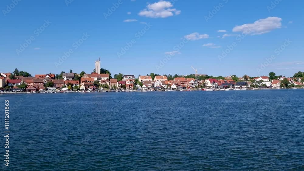 MIKOLAJKI, POLAND June 11, 2023: Cityscape of Mikolajki with ships, boats and yachts from Lake Mikolajskie. Poland MIKOLAJKI, POLAND June 11, 2023: Cityscape of Mikolajki with ships, boats and yachts from Lake Mikolajskie. Poland