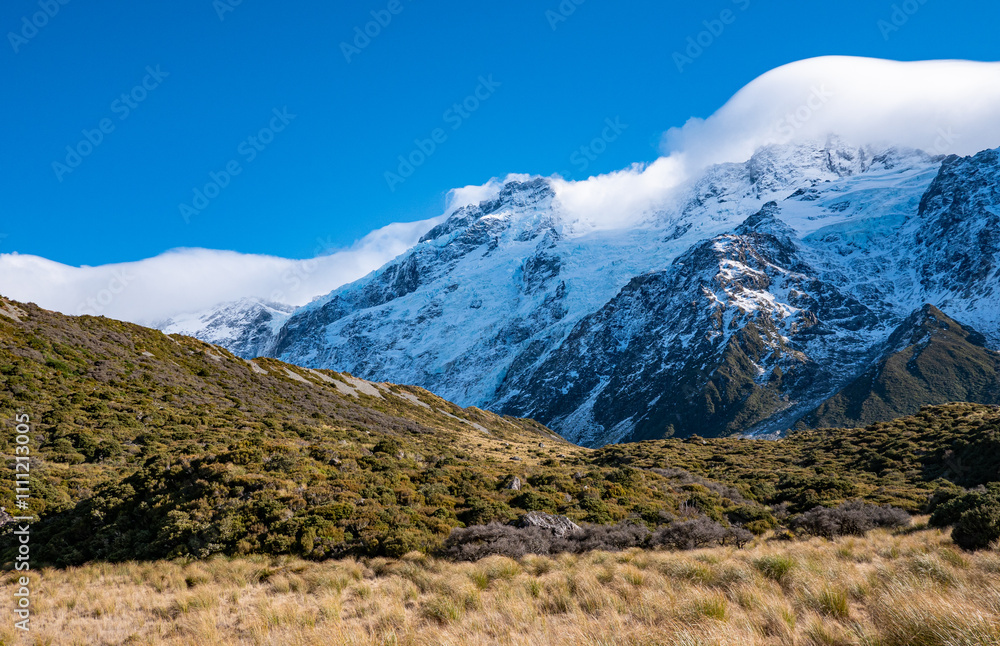 Fototapeta premium Stunning mountain landscape with clouds covering peaks mt cook new zealand national park winter snow peaks