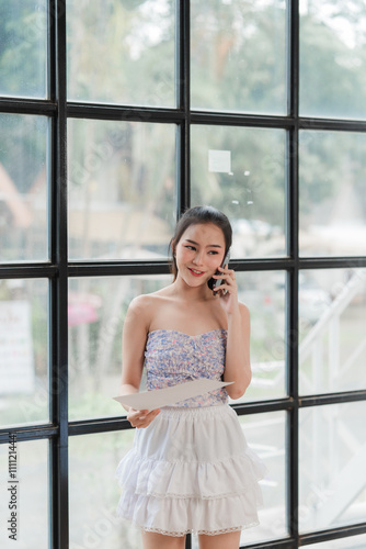 Smiling Woman on Phone Call by Window Free Download Smiling Woman on Phone Call by Window - GFXLoad