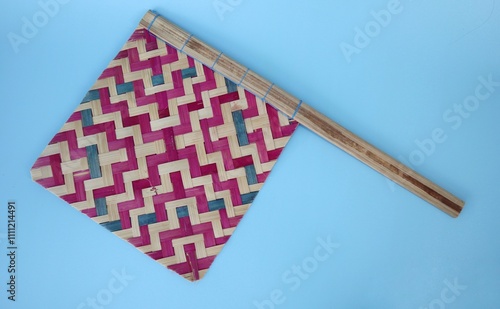 Traditional handmade manual hand fan made from bamboo cane, locally in Java Indonesia called ilir photo