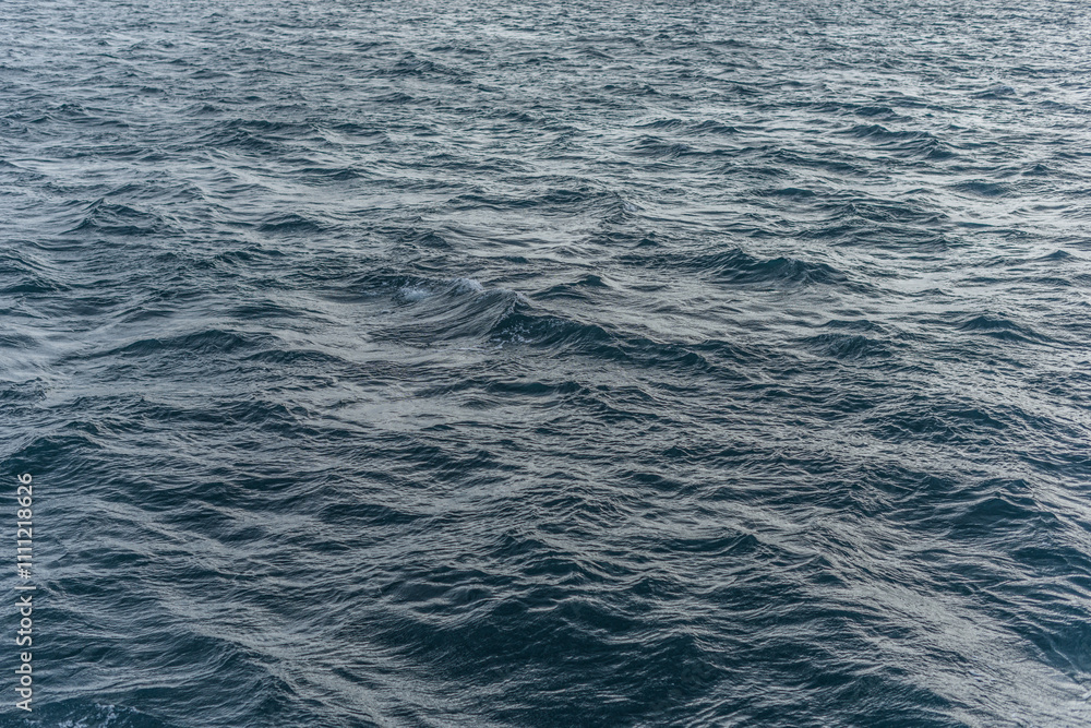 Background Navy textured waves on calm sea Background Navy textured waves on calm sea