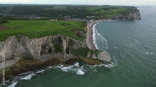 Aerial view of the famous white limestone cliffs at the village of Etretat during sunset, France photo