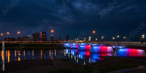 Fotografía illuminated Red White and Blue 5th Street Bridge crosses Miami River at night in