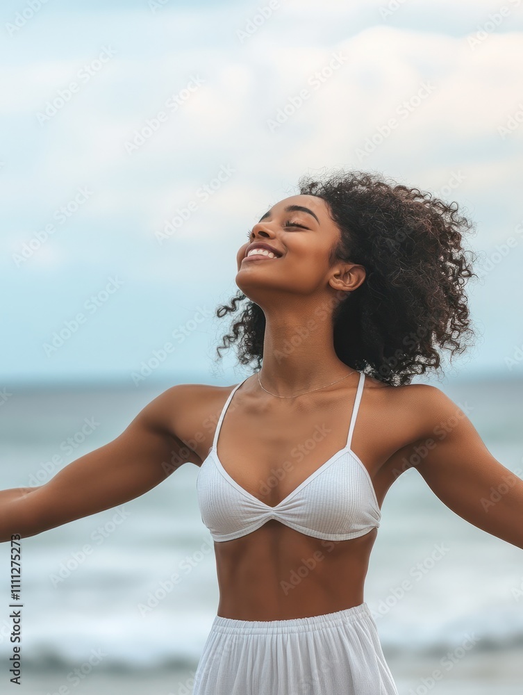 Healthy black woman standing on the beach with copy space. Happy young african american woman with open arms at seaside. Freedom girl dancing and daydreaming at beach during summer vacation. Healthy black woman standing on the beach with copy space. Happy young african american woman with open arms at seaside. Freedom girl dancing and daydreaming at beach during summer vacation.
