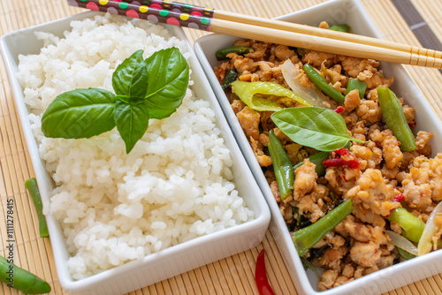 Thai basil chicken is a stir-fry dish made with chopped chicken cooked with chile peppers, garlic, and shallots, and seasoned with a sweet and salty sauce and with fresh basil.