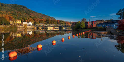 10/12/22 SHEFFIELD FALLS, MA., USA - aerial view at sunrise of Sheffield Falls in autumn, Ma. with Housatonic River running through town, Berkshire Mountains photo