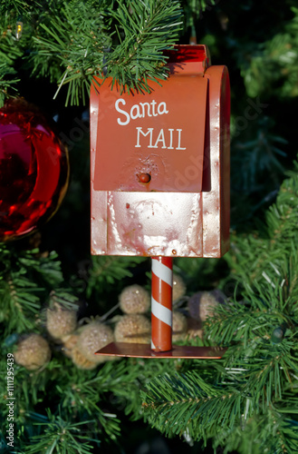 At Christmas, Christmas tree balls and other decorations are used to decorate the Christmas tree. Here, a mailbox for children's wish lists has been hung in red with the inscription Santa MAIL.