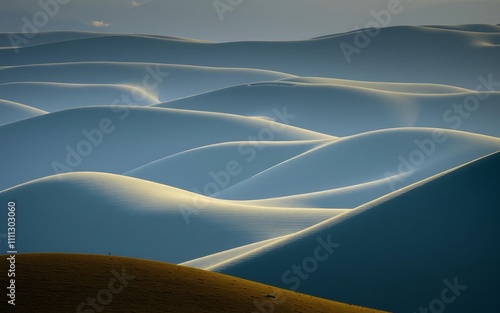 Stunning desert landscape.  Sand dunes, hills, light and shadow, minimalist geometric shapes.  Nature photography. photo