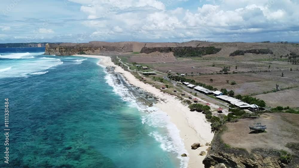 A breathtaking aerial view of a blue beach, captured from a drone. The clear turquoise water meets the soft sandy shore, creating a serene and tranquil coastal landscape. A breathtaking aerial view of a blue beach, captured from a drone. The clear turquoise water meets the soft sandy shore, creating a serene and tranquil coastal landscape.