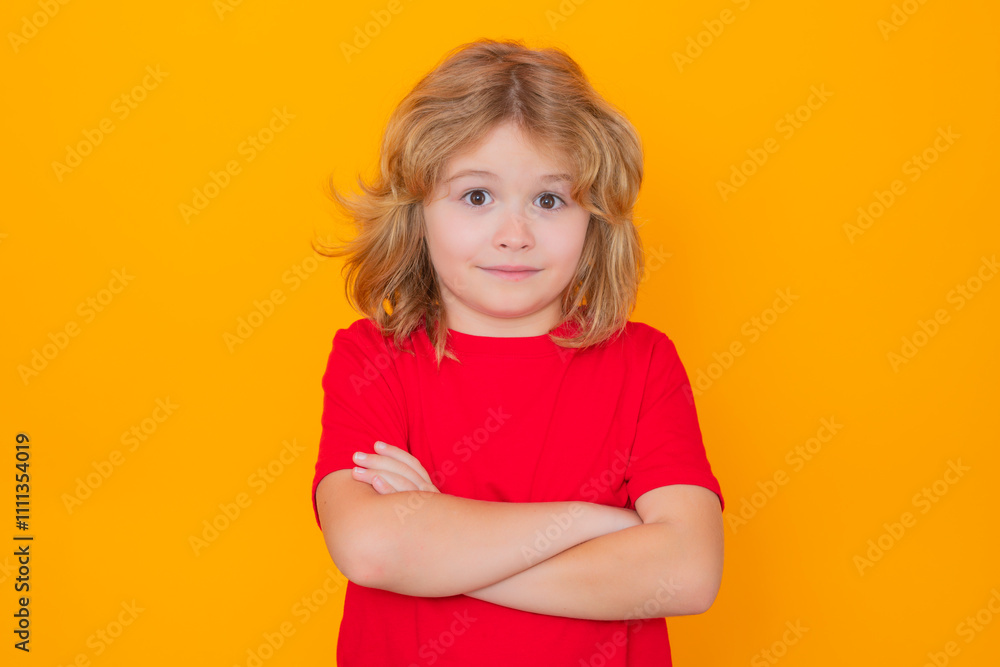 Portrait of funny child with crossed arms on isolated studio background. Portrait of funny child with crossed arms on isolated studio background.