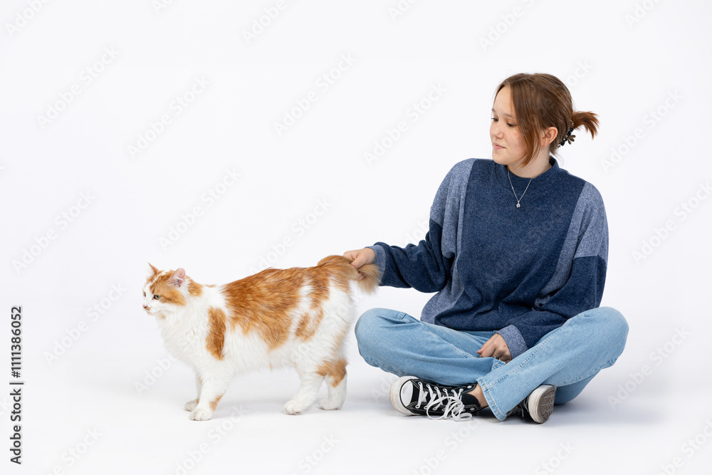 A Relaxed Girl is Playing Joyfully with a Cute Cat in a Cozy Studio Setting, Enjoying life A Relaxed Girl is Playing Joyfully with a Cute Cat in a Cozy Studio Setting, Enjoying life