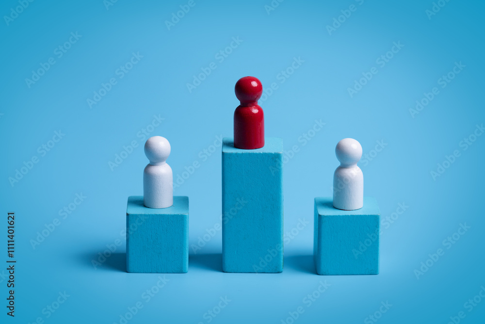 Red wooden figure standing on wooden podium for business leadership for team leader concept. Red wooden figure standing on wooden podium for business leadership for team leader concept.