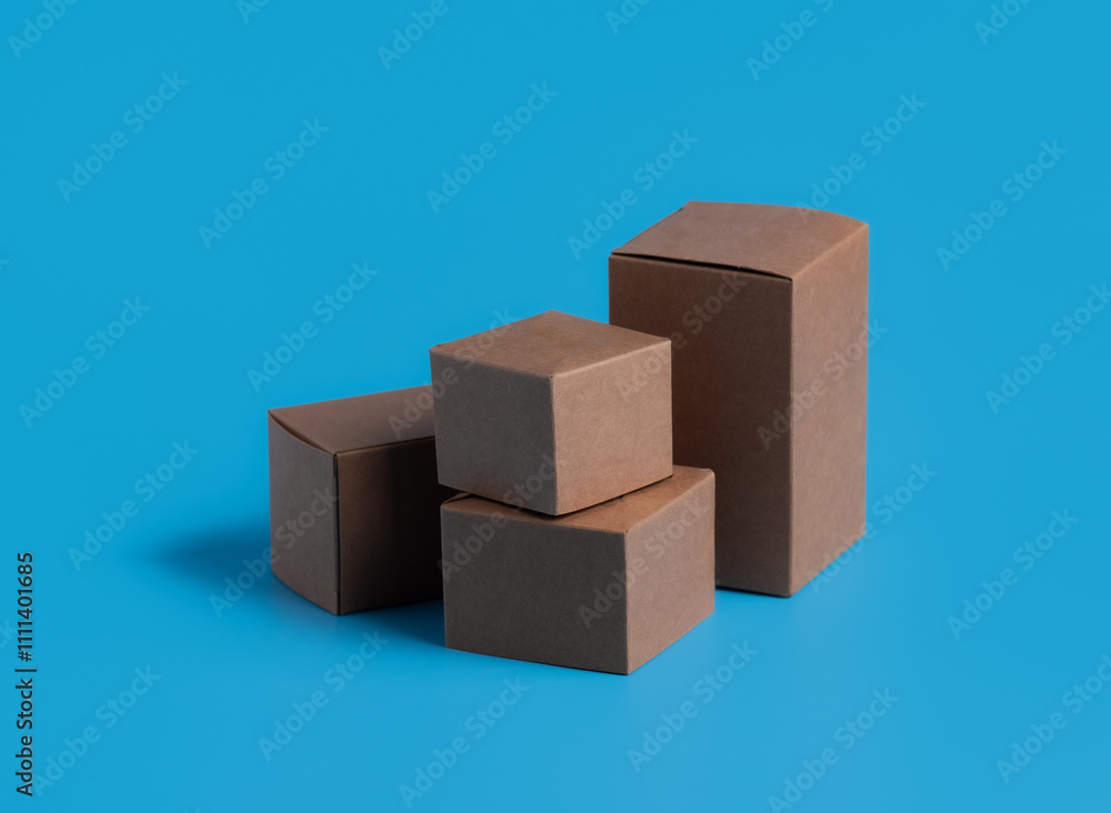 Obraz premium Stacked cardboard boxes on a blue background