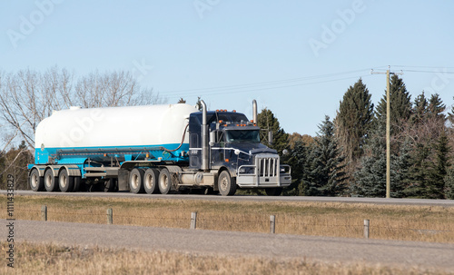 Heavy Cargo on th eroad. A truck hauling freight along a highway. Taken in Alberta, Canada