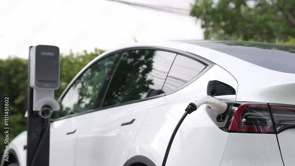 Electric vehicle technology utilized to residential area or home charging station for EV car battery recharge. Eco-friendly transport by clean and sustainable energy for future environment. Fastidious Electric vehicle technology utilized to residential area or home charging station for EV car battery recharge. Eco-friendly transport by clean and sustainable energy for future environment. Fastidious