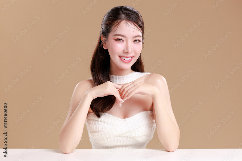 Elegant Asian woman model with natural makeup on face clean fresh skin on isolated Beige background. Elegant Asian woman model with natural makeup on face clean fresh skin on isolated Beige background.