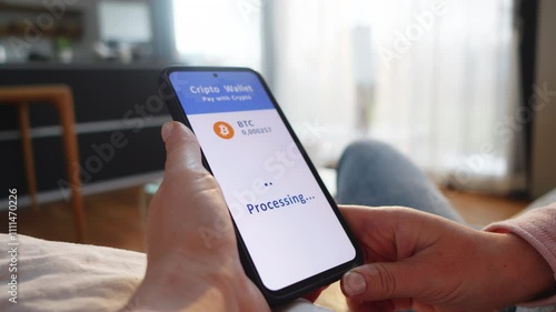 Woman paying with crypto wallet on smartphone close up. Buyer clicking button on mobile screen wile making cryptocurrency payment online closeup photo