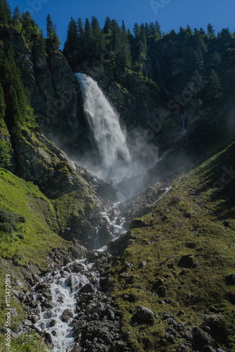 The Waterfall. Beauty in nature, amazing waterfall in forest. Waterfall in forest in alps landscape. Cascading waterfall.