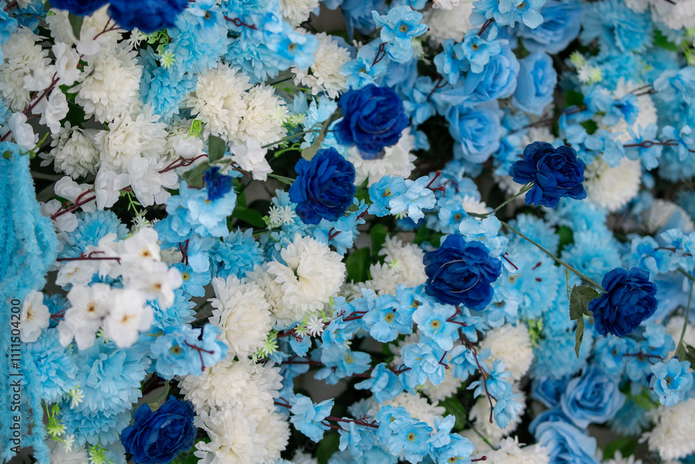 Naklejka premium Abundant bouquet of vibrant blue and white flowers, Stunning floral arrangement in natural light, Delicate and eye-catching wedding florals.