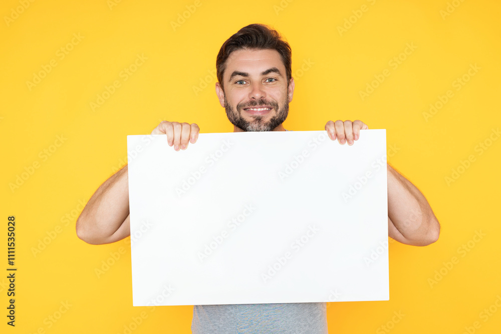 Blank signboard, billboard or banner with copy space. Happy attractive handsome smiling middle aged man showing promo blank board on studio background. Advertisement concept. Blank mockup. Blank signboard, billboard or banner with copy space. Happy attractive handsome smiling middle aged man showing promo blank board on studio background. Advertisement concept. Blank mockup.
