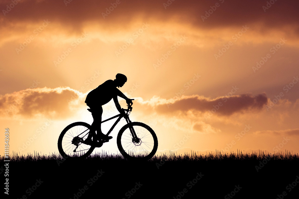 Silhouette of Cyclist Riding Bicycle at Sunset with Dramatic Sky and Clouds in the Background Silhouette of Cyclist Riding Bicycle at Sunset with Dramatic Sky and Clouds in the Background
