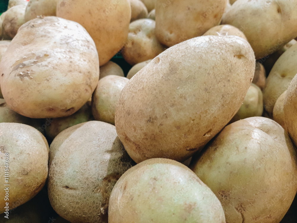 Abstract shapes, patterns and textures of piles of potatoes. Potatoes look clean and fresh. For graphic design or banner background. Harvest potatoes Abstract shapes, patterns and textures of piles of potatoes. Potatoes look clean and fresh. For graphic design or banner background. Harvest potatoes
