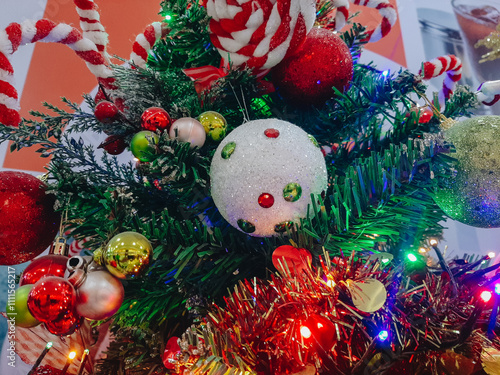 background concept of green Christmas tree with decorate with red ball and gift for happy new year day party photo