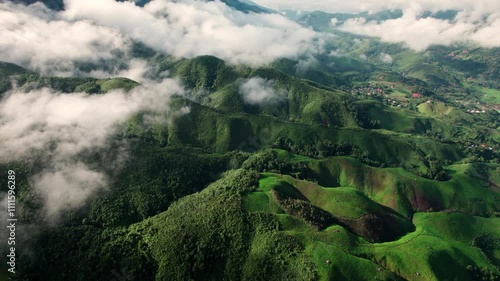 Landscape of Morning Mist with Mountain Layer. mountain ridge and clouds in rural jungle bush forest