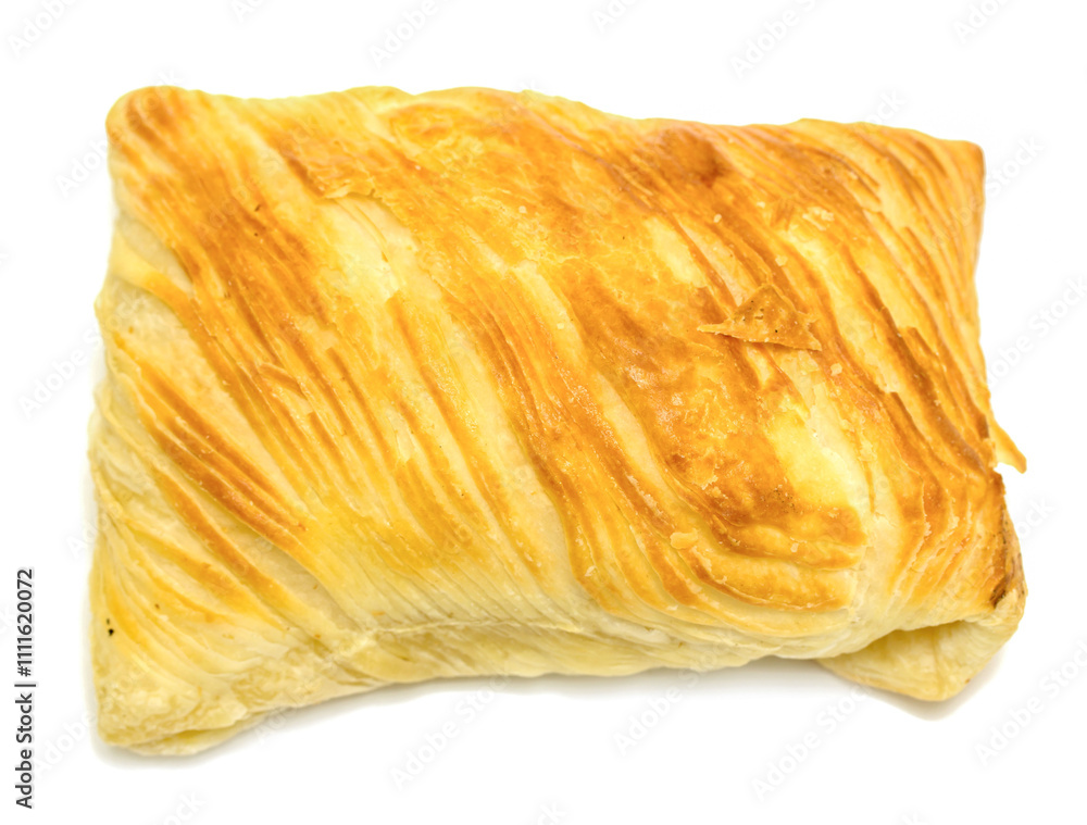 A pastry with a golden crust and a yellow filling A pastry with a golden crust and a yellow filling