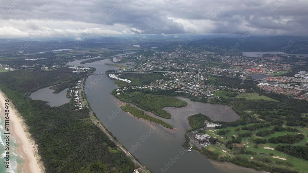 Tweed River With Views Of Tonys Island And Wommin Lake On Cloudy Day. Fingal Head In NSW, Australia. aerial pullback shot Tweed River With Views Of Tonys Island And Wommin Lake On Cloudy Day. Fingal Head In NSW, Australia. aerial pullback shot