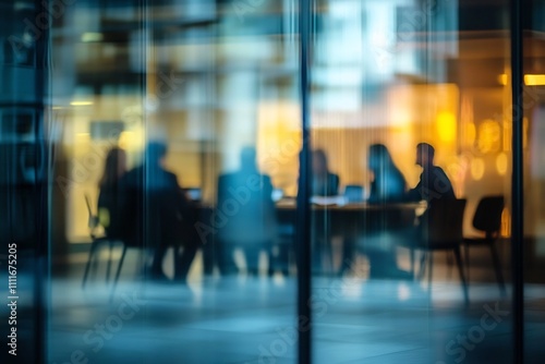 Defocused Management Meeting Behind Glass Wall