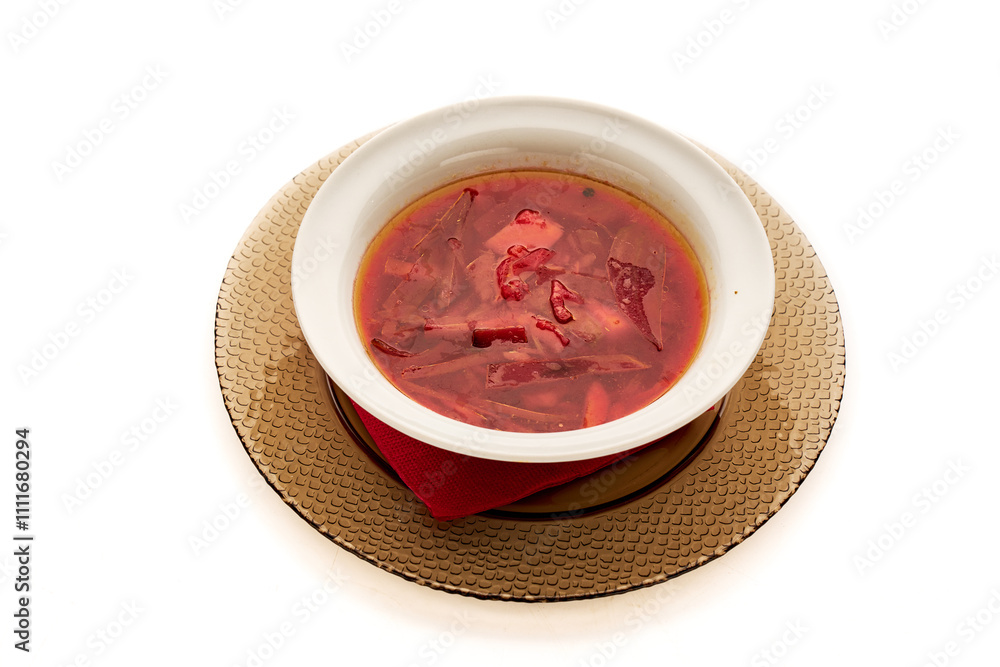 A bowl of soup with a red napkin on top A bowl of soup with a red napkin on top