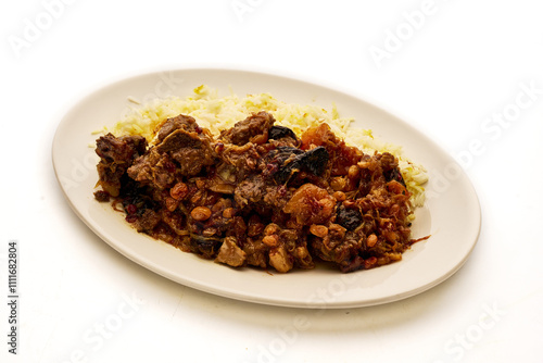 A plate of food with rice and meat on it