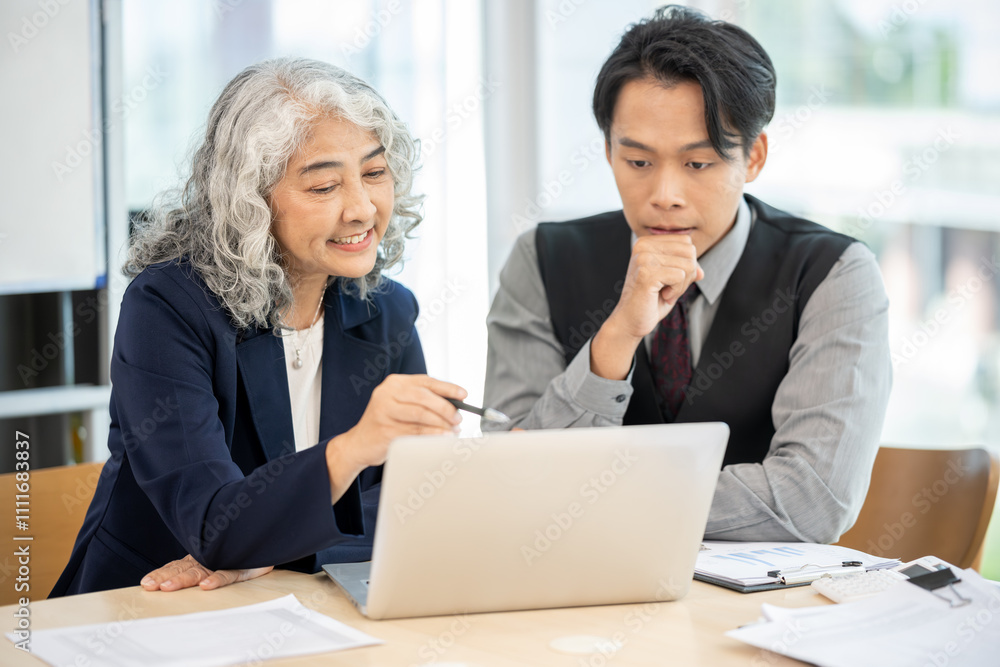 Executives are having a meeting with employees to discuss business planning in a conference room. Executives are having a meeting with employees to discuss business planning in a conference room.